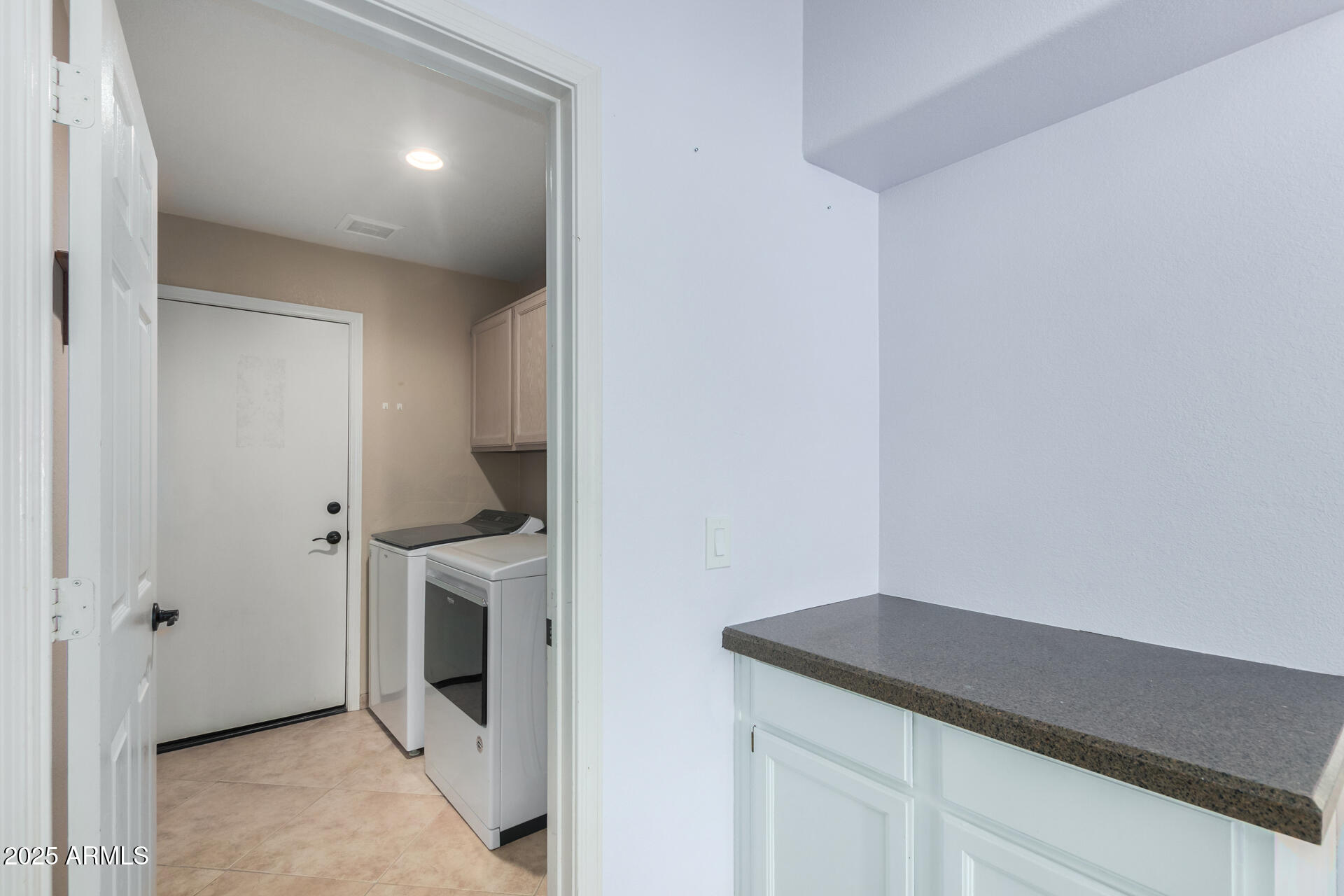 4226 East Rockledge Road Phoenix, AZ 85044 - Photo 27 of 36 a room with a washer and dryer