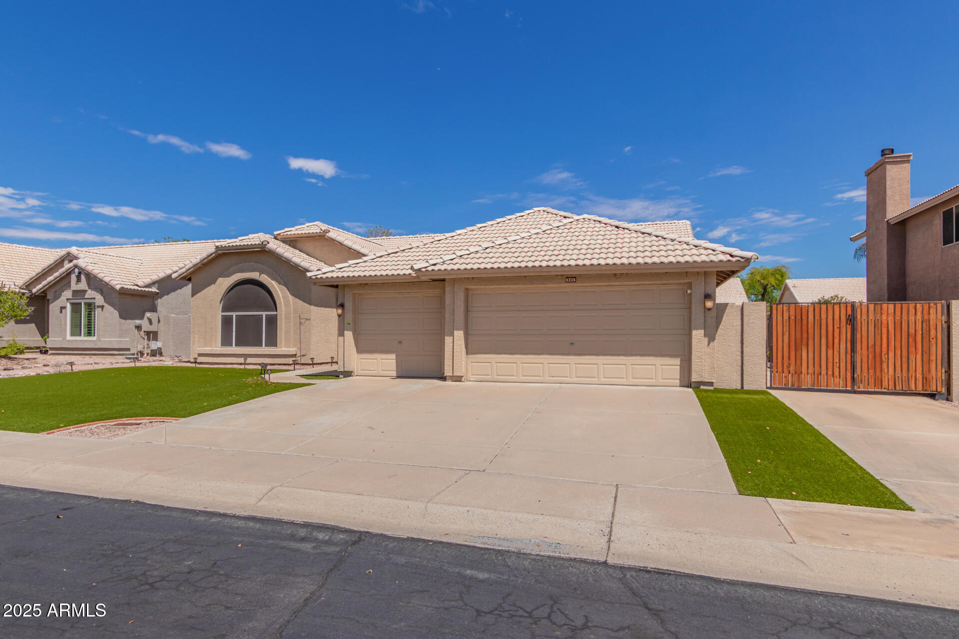 4226 East Rockledge Road Phoenix, AZ 85044 - Photo 3 of 36 a front view of a house with a yard and garage