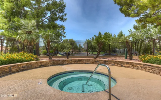 a view of a swimming pool with a patio