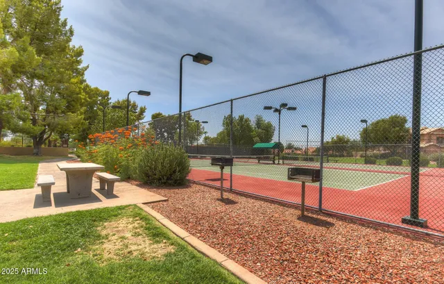 a view of a swimming pool with a yard