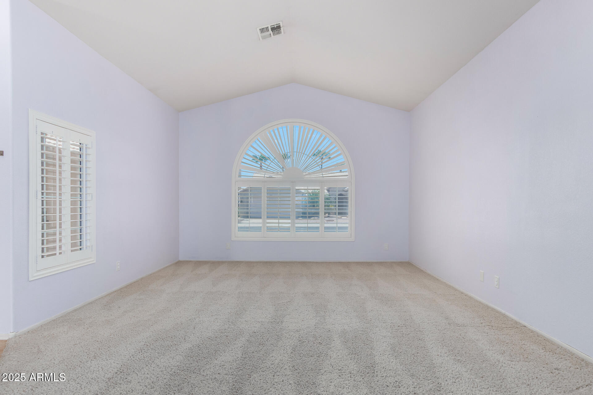 4226 East Rockledge Road Phoenix, AZ 85044 - Photo 6 of 36 an empty room with a window