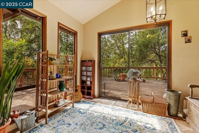 a view of a bedroom with bed and balcony