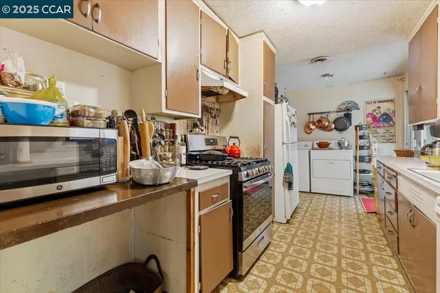 a kitchen with stainless steel appliances granite countertop a stove and a sink