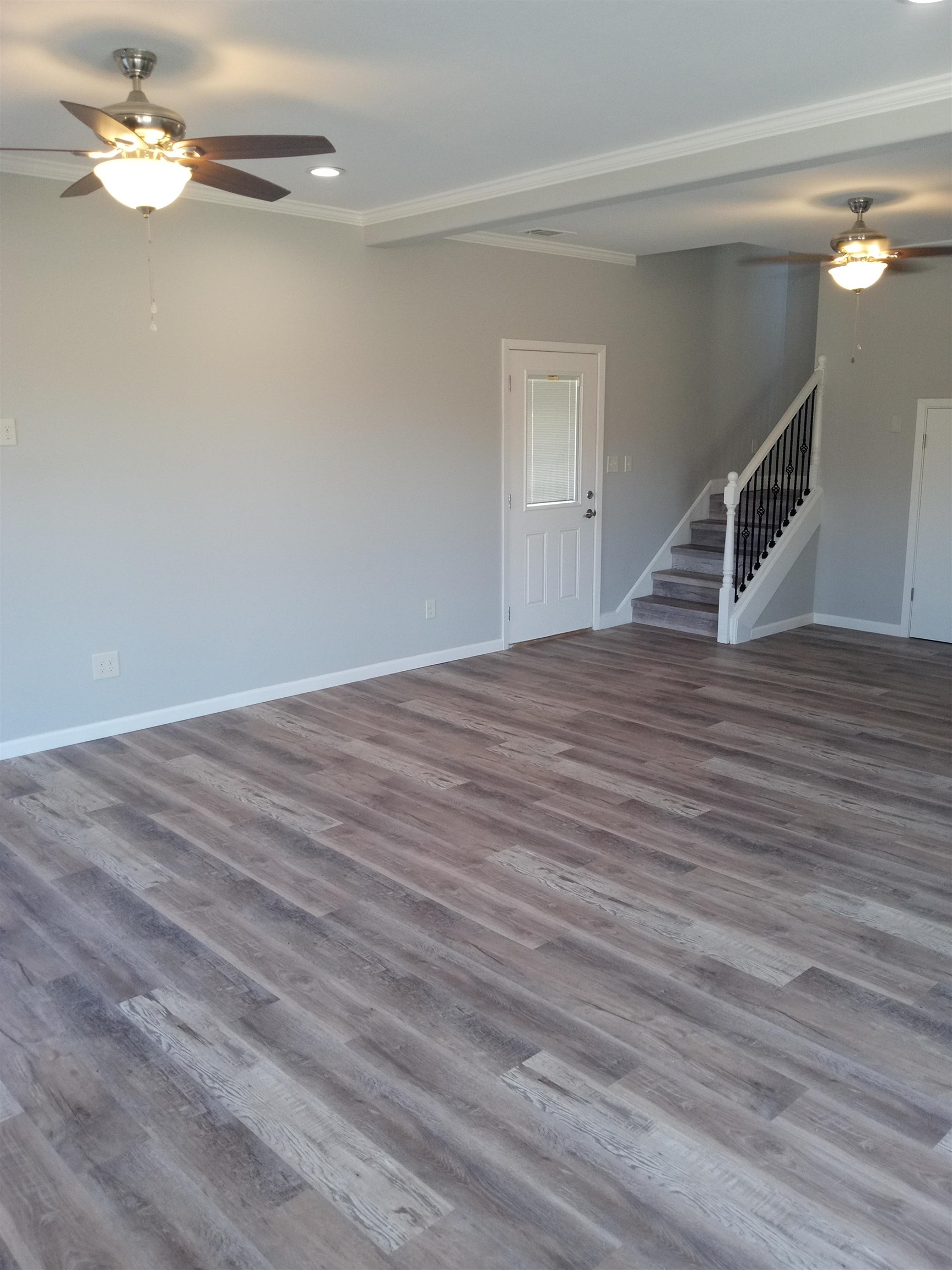 1712 Sanders Road Stanton, TN 38069 - Photo 4 of 10 Unfurnished living room featuring crown molding, ceiling fan, and hardwood / wood-style floors