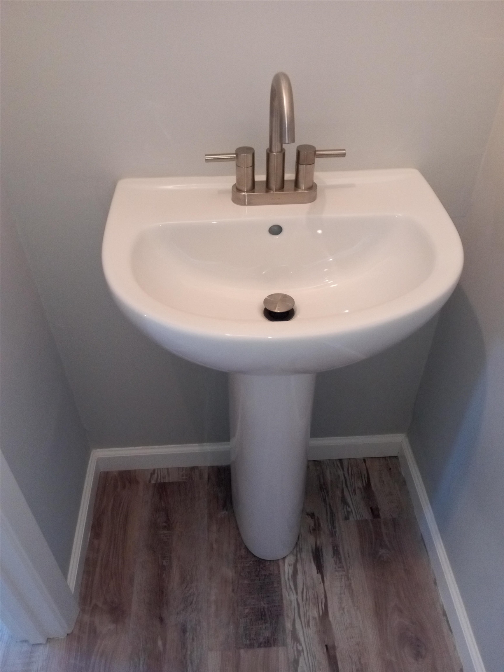 1712 Sanders Road Stanton, TN 38069 - Photo 10 of 10 Bathroom with wood-type flooring and sink