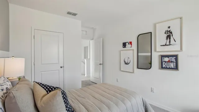 a bedroom with a bed and a couch