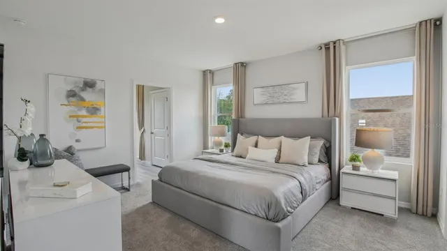 a bedroom with a bed and a cabinets