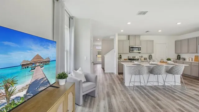 a view of kitchen with cabinets and wooden floor