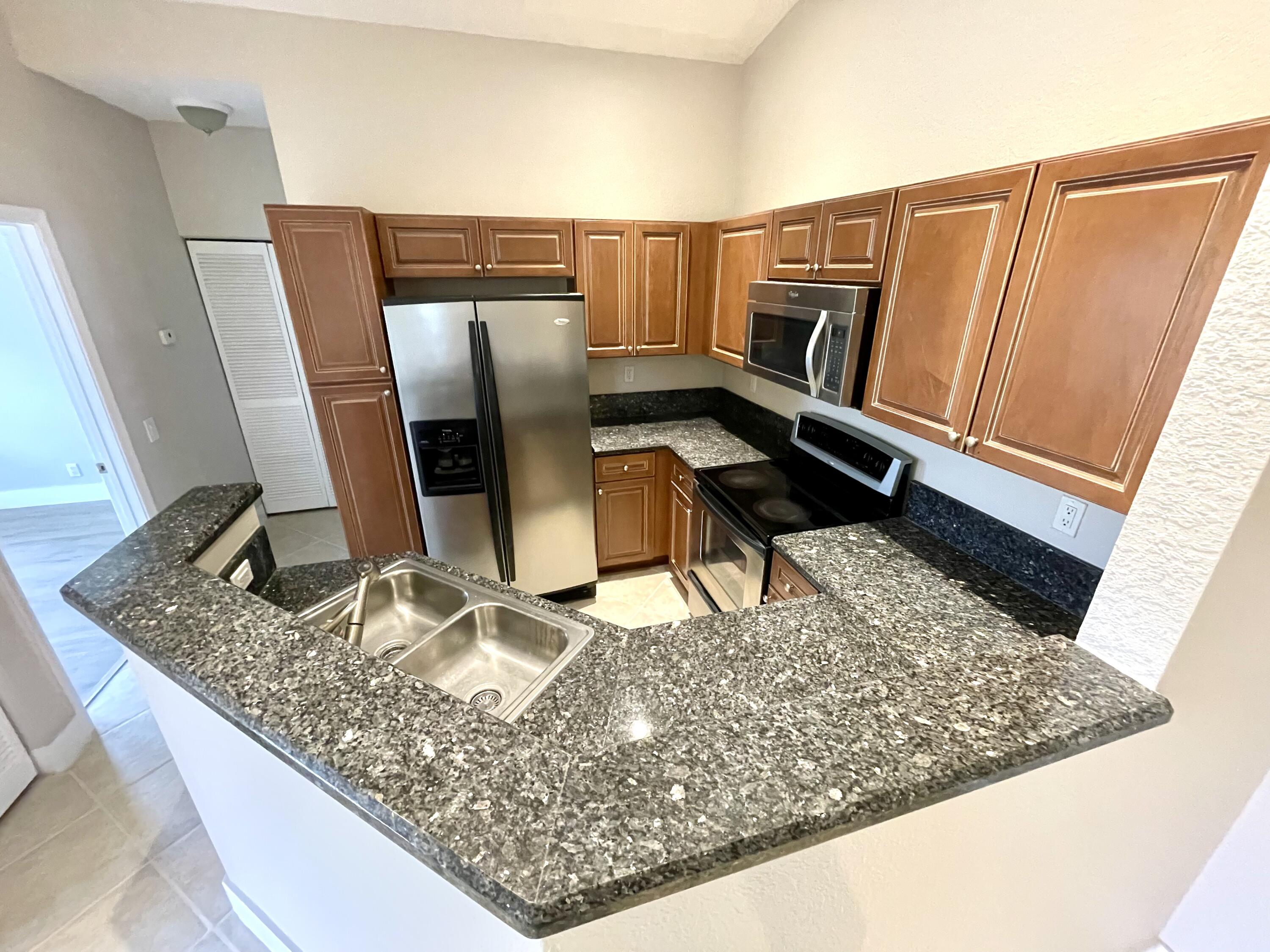 3043 Laurel Ridge Circle Riviera Beach, FL 33404 - Photo 11 of 35 KITCHEN