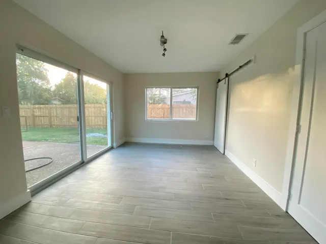 a view of an empty room and window