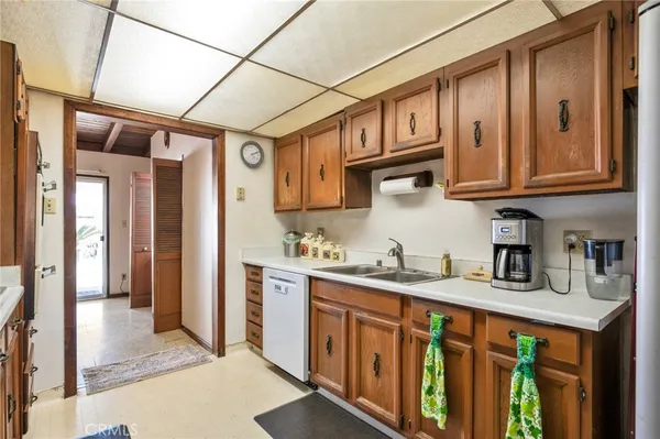 a kitchen with stainless steel appliances granite countertop a stove and a refrigerator