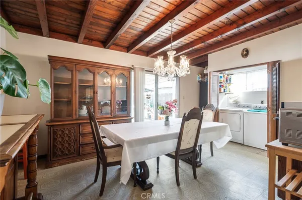 a dining room with furniture and window