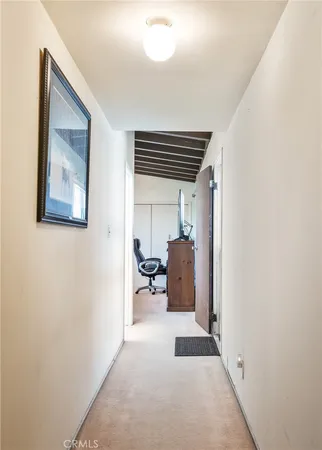 a bathroom with a granite countertop sink a toilet and a mirror