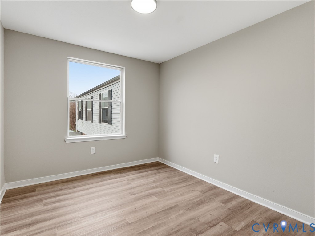 3518 East Richmond Road, Unit U3 Richmond, VA 23223 - Photo 12 of 19 a view of empty room with wooden floor and fan