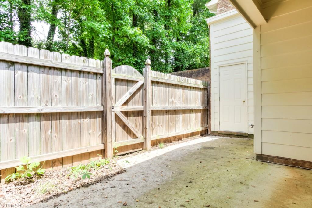 4924 Tower Road, Unit D Greensboro, NC 27410 - Photo 16 of 19 nice covered patio, totally private, storage for outside equipment