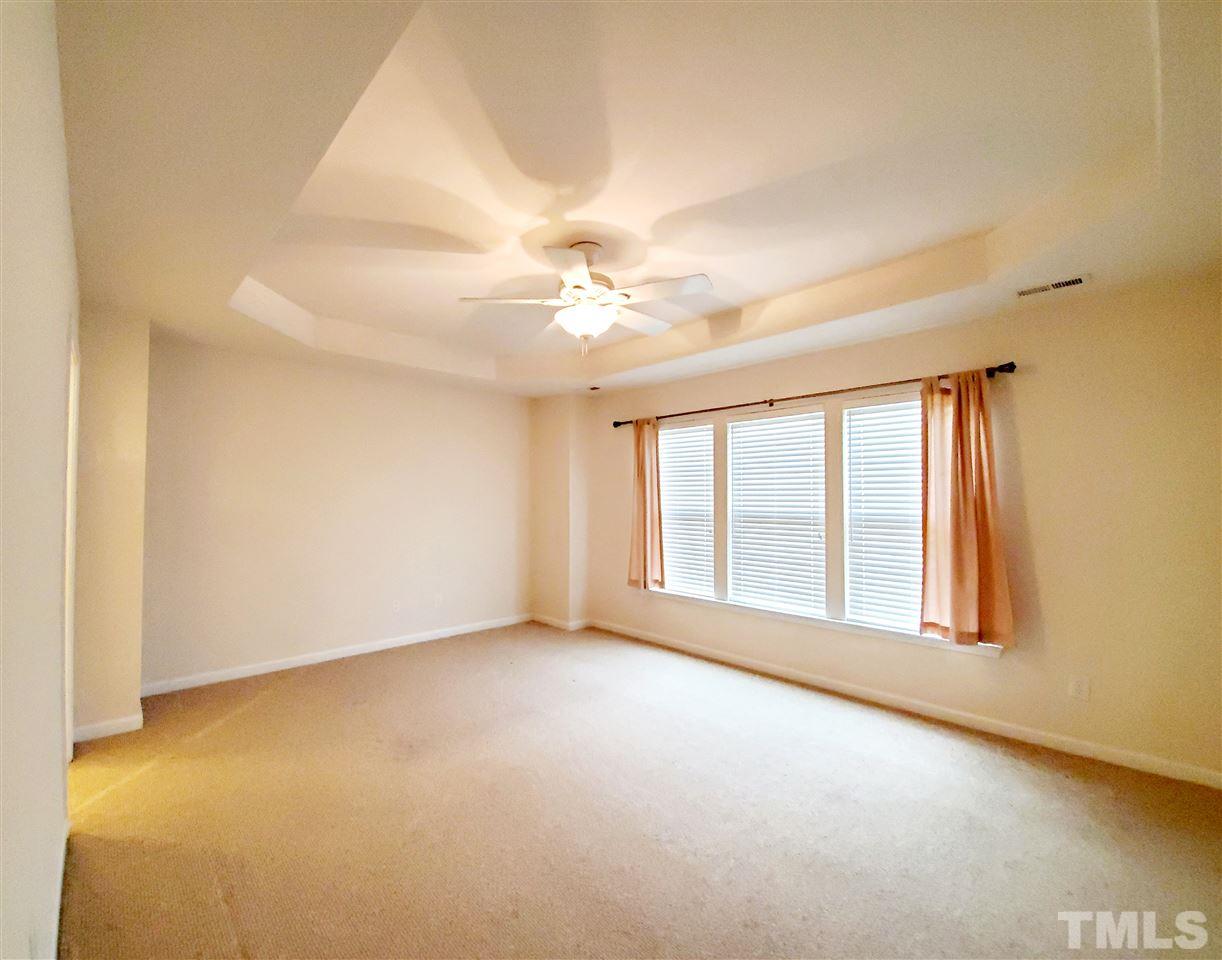 8332 Saltwood Place Raleigh, NC 27617 - Photo 4 of 16 a view of an empty room with a window
