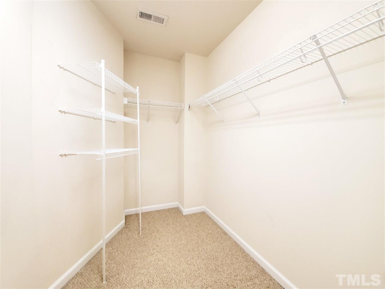 8332 Saltwood Place Raleigh, NC 27617 - Photo 6 of 16 a view of a room with shelf