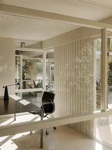 a view of a room with a table and chair