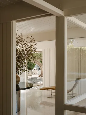 a living room with furniture and a rug