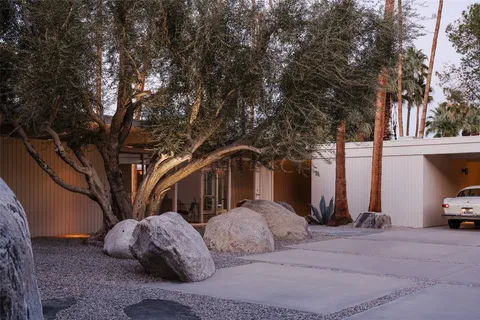 a view of a car parked in front of a house
