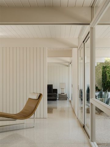 a view of a balcony with chair and the potted plant