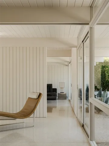 a view of a balcony with chair and the potted plant