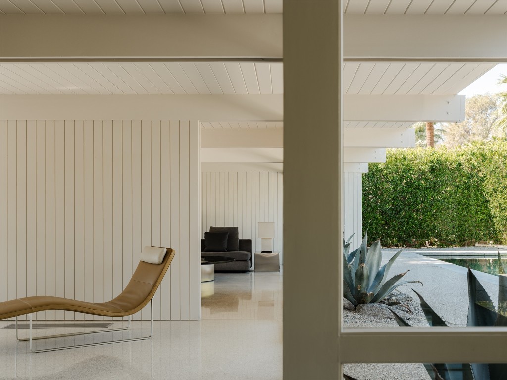 1272 East Verbena Drive Palm Springs, CA 92262 - Photo 23 of 40 a view of a balcony with chair and the potted plant