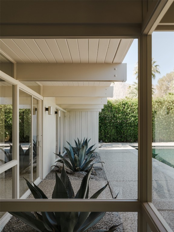 1272 East Verbena Drive Palm Springs, CA 92262 - Photo 24 of 40 a potted plant sitting in front of a window