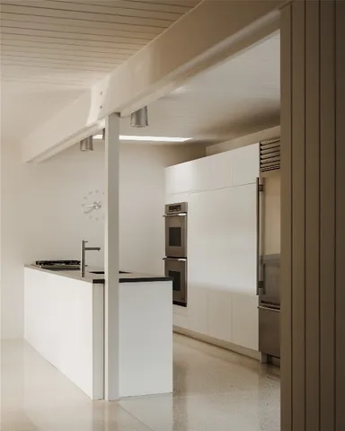 a living room with fireplace furniture and a large window