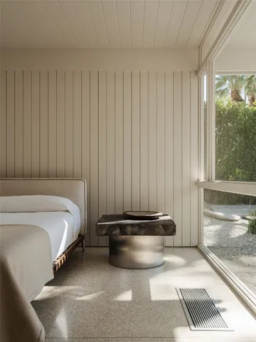 a bathroom with a granite countertop sink and shower