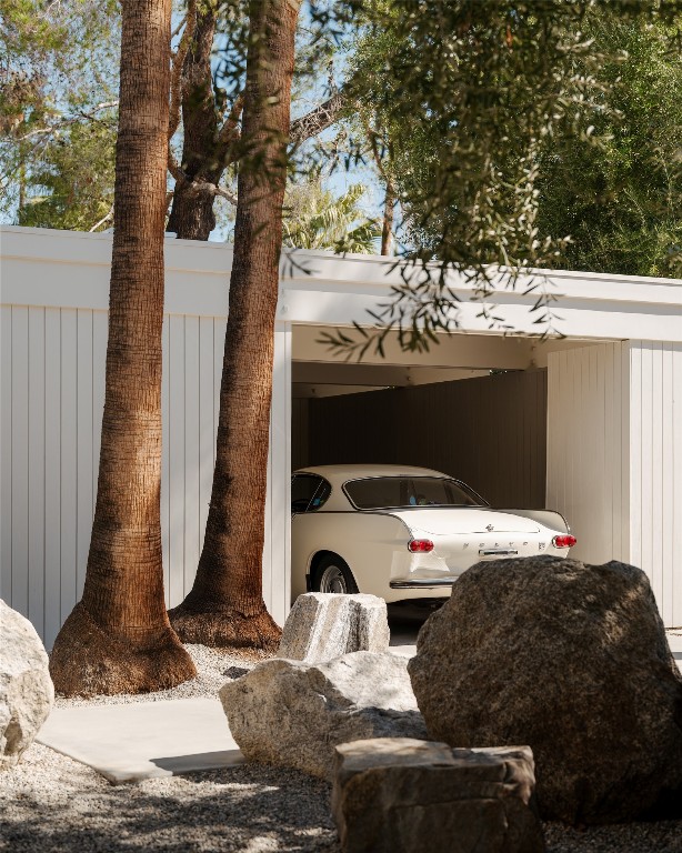 1272 East Verbena Drive Palm Springs, CA 92262 - Photo 6 of 40 a bedroom with a bed and a large tree