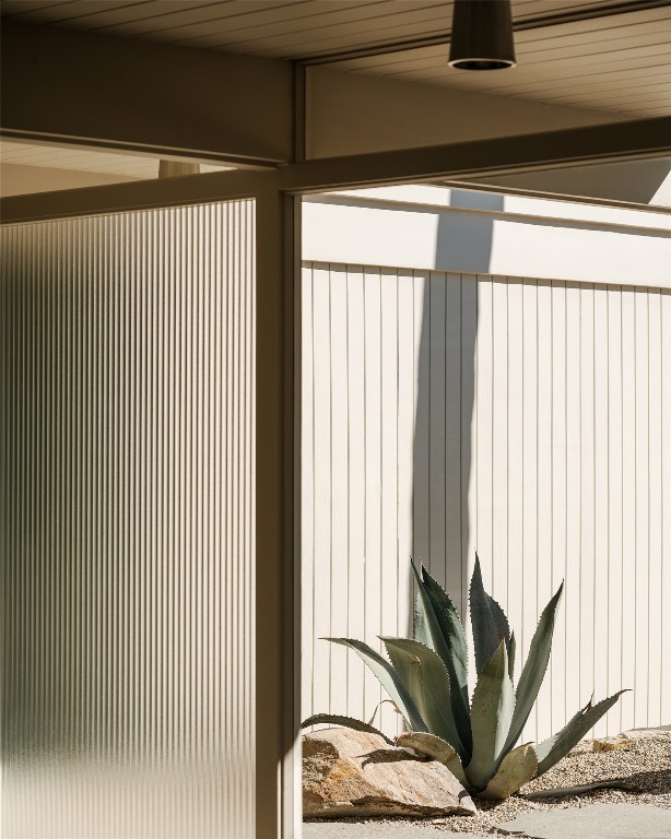 1272 East Verbena Drive Palm Springs, CA 92262 - Photo 7 of 40 a view of a potted plant on a window