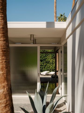 a view of an entryway with garden