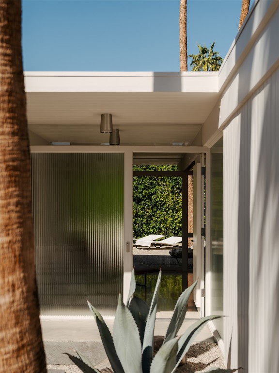 1272 East Verbena Drive Palm Springs, CA 92262 - Photo 8 of 40 a view of an entryway with garden