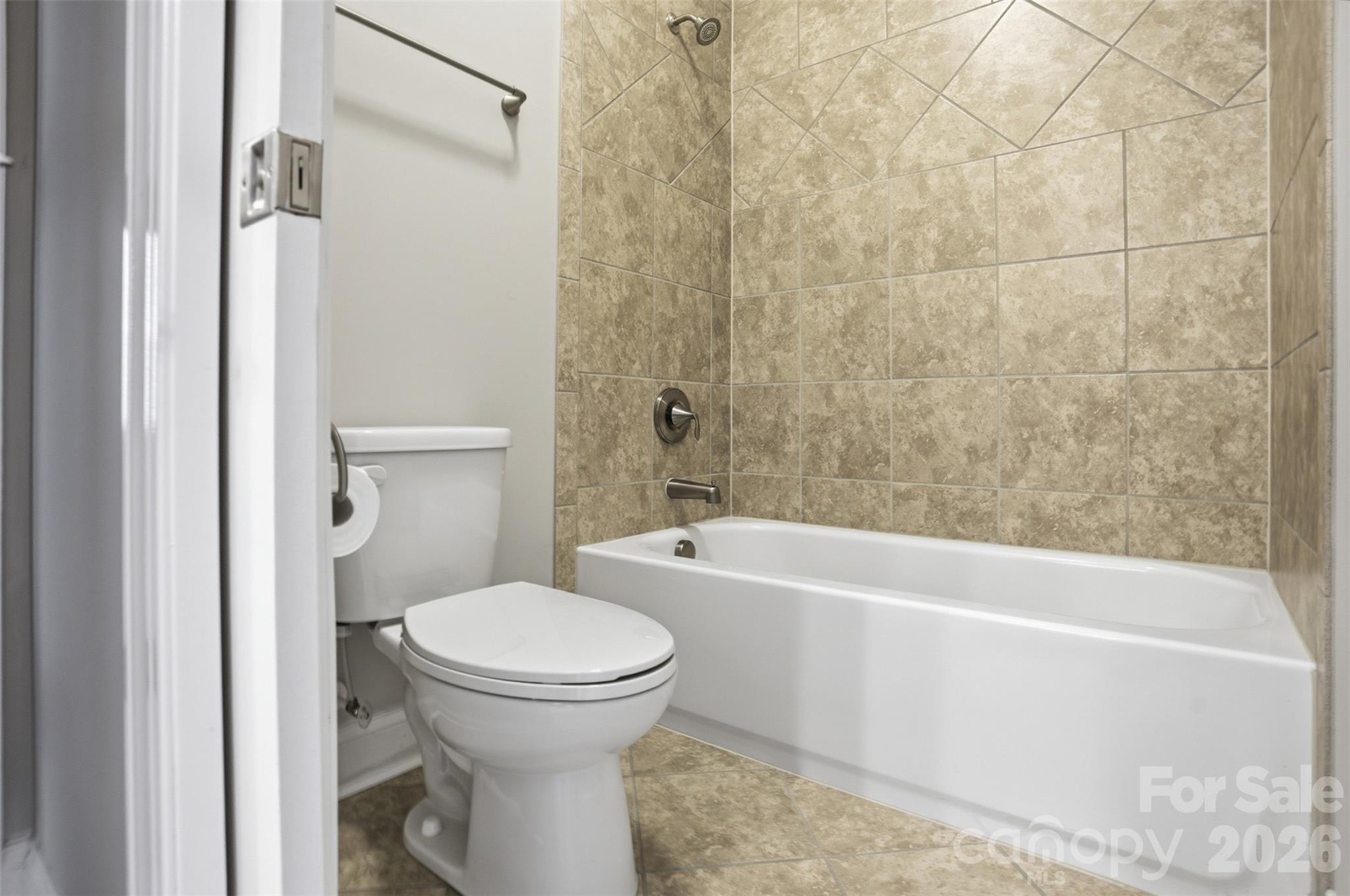 14022 Salem Ridge Road Huntersville, NC 28078 - Photo 26 of 38 a bathroom with a toilet and a bathtub
