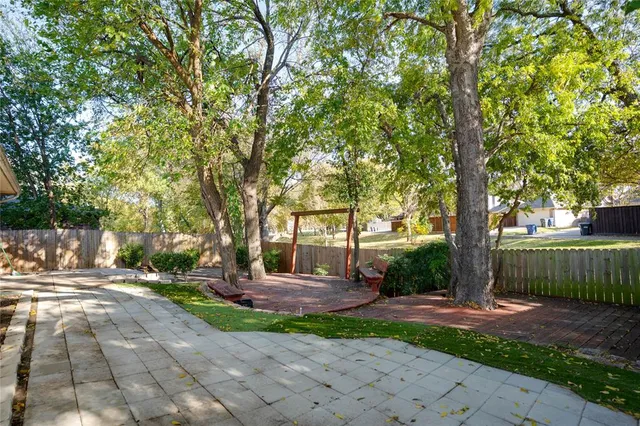 a view of backyard with green space