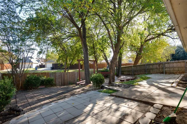 a backyard of a house with lots of green space