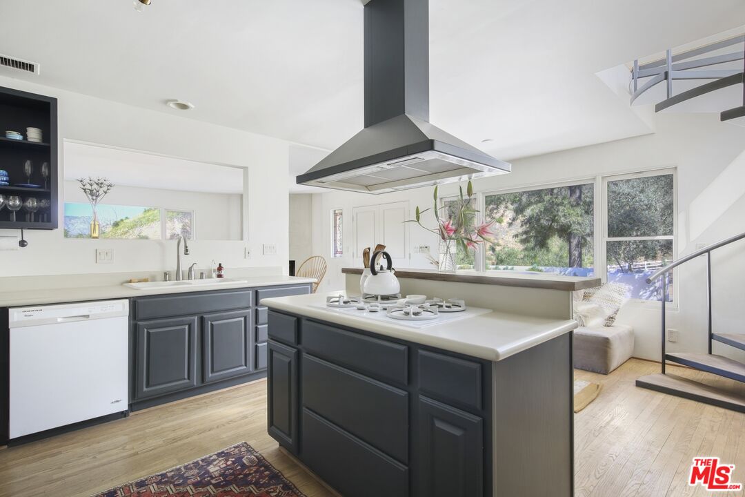 9609 Wornom Avenue Sunland, CA 91040 - Photo 17 of 52 a kitchen with a sink and a stove top oven