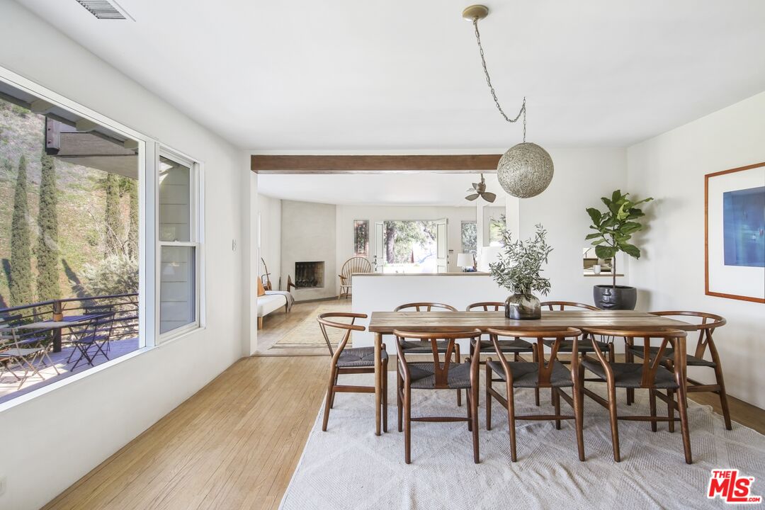 9609 Wornom Avenue Sunland, CA 91040 - Photo 20 of 52 a view of a dining room with furniture window and wooden floor