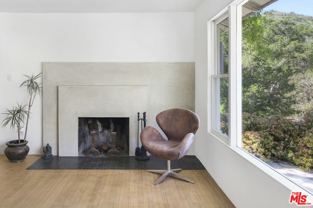 9609 Wornom Avenue Sunland, CA 91040 - Photo 22 of 52 a living room with furniture and a fireplace