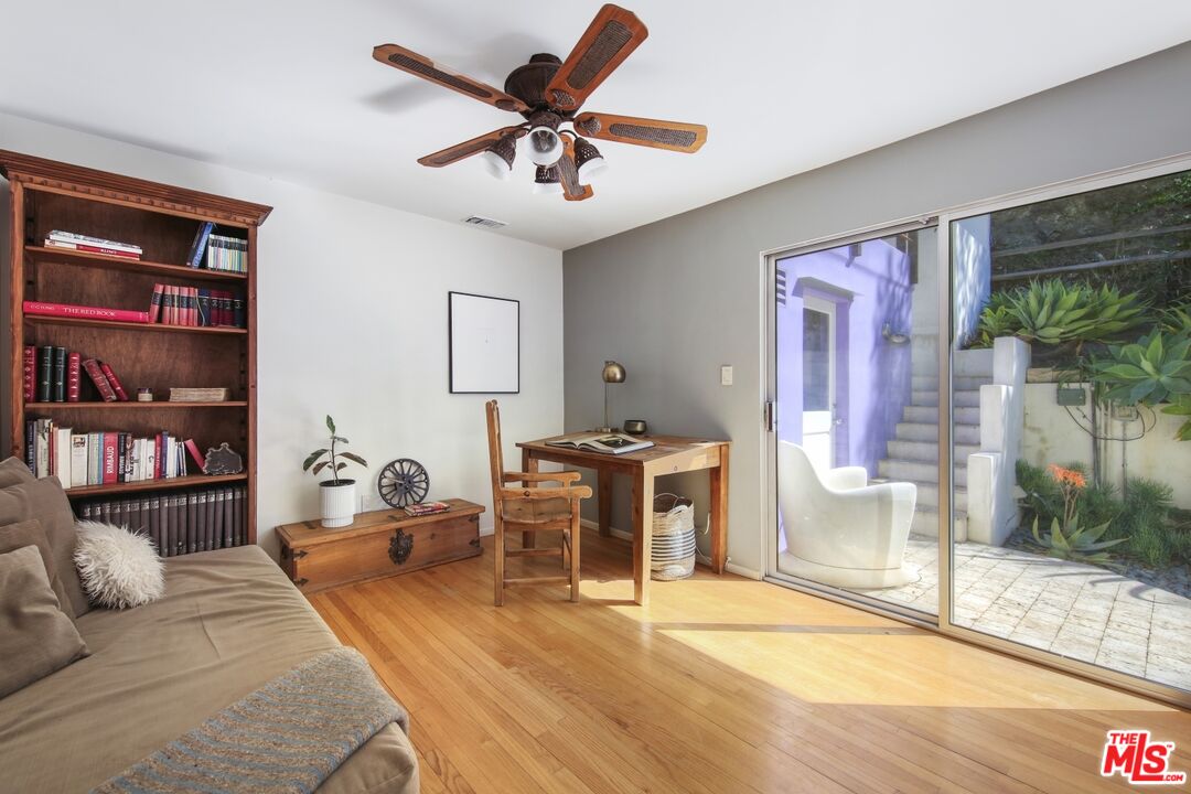9609 Wornom Avenue Sunland, CA 91040 - Photo 25 of 52 a living room with furniture and a floor to ceiling window