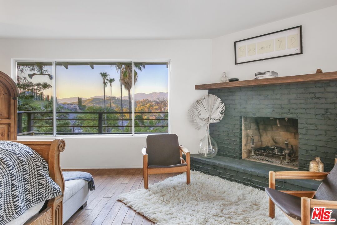 9609 Wornom Avenue Sunland, CA 91040 - Photo 26 of 52 a living room with furniture and a fireplace