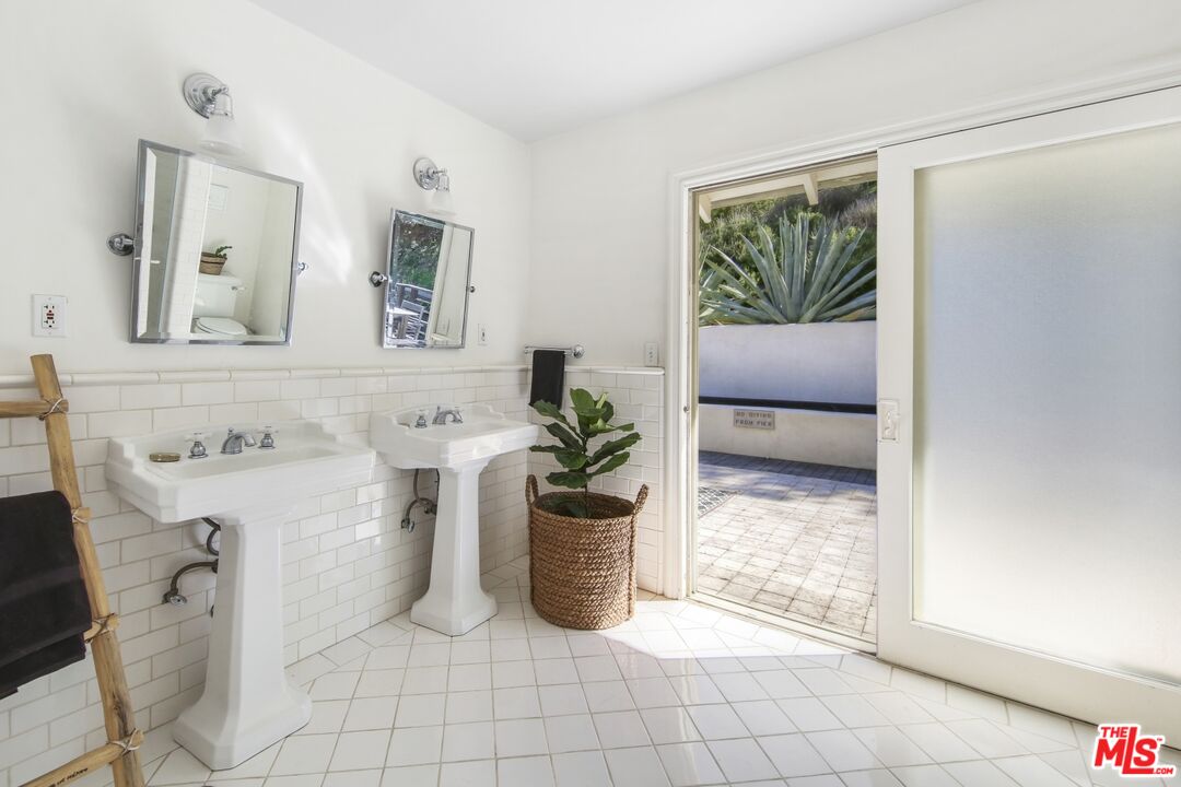 9609 Wornom Avenue Sunland, CA 91040 - Photo 29 of 52 a living room with furniture and a potted plant
