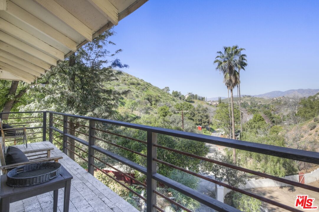 9609 Wornom Avenue Sunland, CA 91040 - Photo 30 of 52 a view of a balcony with wooden fence and floor