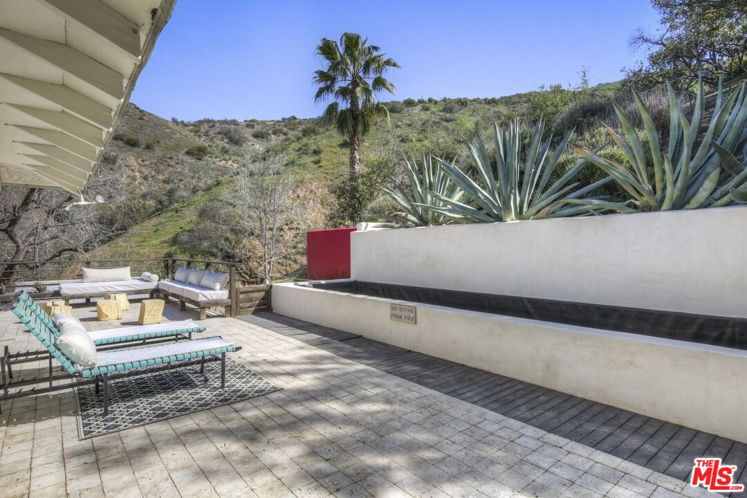 9609 Wornom Avenue Sunland, CA 91040 - Photo 35 of 52 a view of a bench in a backyard