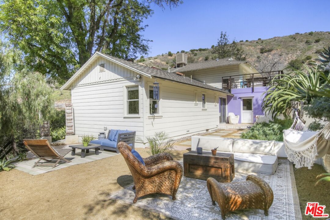 9609 Wornom Avenue Sunland, CA 91040 - Photo 36 of 52 a view of a patio with couches table and chairs and potted plants