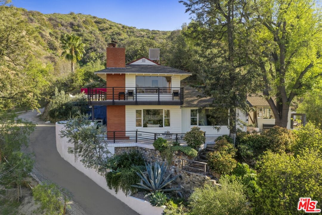 9609 Wornom Avenue Sunland, CA 91040 - Photo 4 of 52 a front view of a house with a yard