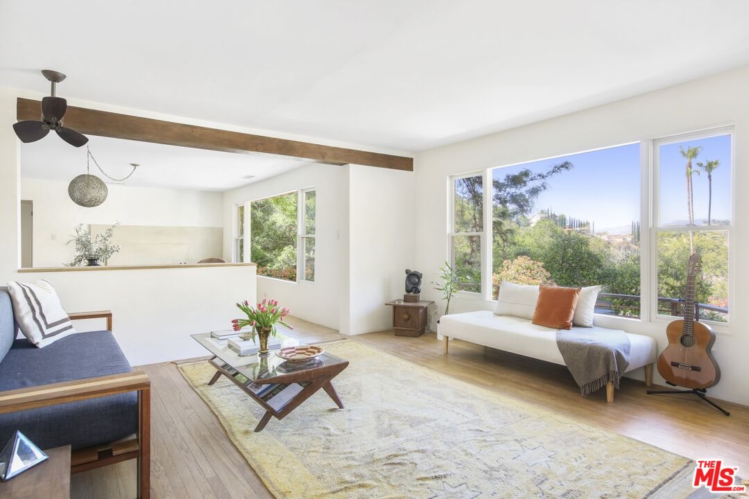 9609 Wornom Avenue Sunland, CA 91040 - Photo 9 of 52 a living room with furniture and a large window
