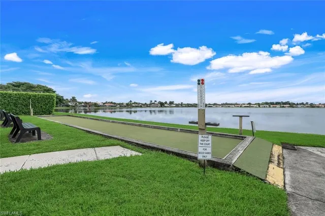 a view of a patio with a table and chairs
