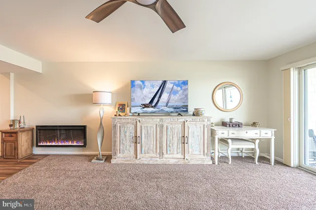 a view of a livingroom with furniture and a fireplace